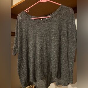 Gray Top. Size Small. Front is shorter than back.